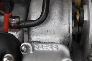 77166